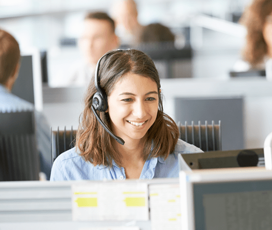 Customer support agent smiling while providing support to customer